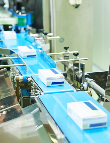 Boxes of medication on a conveyor belt.